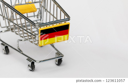 Shopping, VAT and retail in Germany concept. Shopping Cart with German flag on white background 123611057