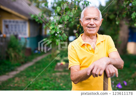 Man professional horticulturist with garden shovel working at land Man professional horticulturist with garden shovel working at land 123611178