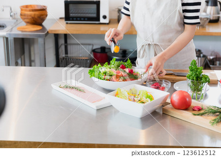 Young woman standing in the kitchen Young woman standing in the kitchen 123612512