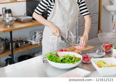 Young woman standing in the kitchen Young woman standing in the kitchen 123612523