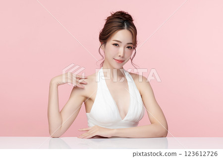 Beautiful young asian woman with clean fresh skin on pink background, Face care, Facial treatment, Cosmetology, beauty and spa, Asian women portrait. 123612726