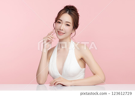Beautiful young asian woman with clean fresh skin on pink background, Face care, Facial treatment, Cosmetology, beauty and spa, Asian women portrait. Beautiful young asian woman with clean fresh skin on pink background, Face care, Facial treatment, Cosmetology, beauty and spa, Asian women portrait. 123612729