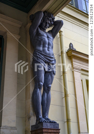 19th century sculpture of Atlantean holding the portico of the Hermitage in St. Petersburg, Russia 123612934