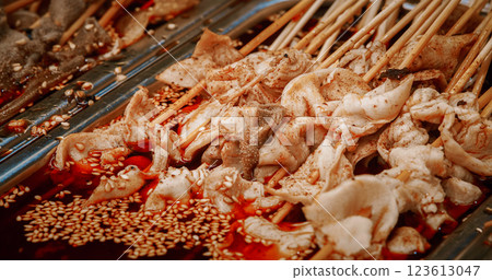 Chengdu, Sichuan, China. Beef Tripe On Skewers, close-up view. Tripe Is Type Of Edible Lining From The Stomachs Of Various Farm Animals. Tripe Is Eaten In Many Parts Of The World. Tripe Soup Is Made Chengdu, Sichuan, China. Beef Tripe On Skewers, close-up view. Tripe Is Type Of Edible Lining From The Stomachs Of Various Farm Animals. Tripe Is Eaten In Many Parts Of The World. Tripe Soup Is Made 123613047