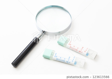 Stool test kit and magnifying glass Stool test kit and magnifying glass 123613566