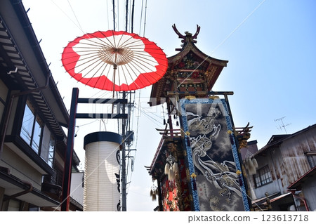 Takayama City, Gifu Prefecture, Japan: Spring Takayama Festival: A gorgeous hanging scroll of parading floats and decorations, Japanese umbrellas and lanterns hung on the road Takayama City, Gifu Prefecture, Japan: Spring Takayama Festival: A gorgeous hanging scroll of parading floats and decorations, Japanese umbrellas and lanterns hung on the road 123613718