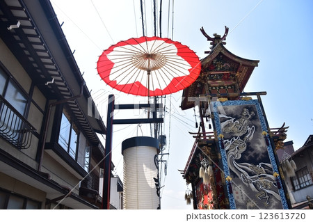 Takayama City, Gifu Prefecture, Japan: Spring Takayama Festival: A gorgeous hanging scroll of parading floats and decorations, Japanese umbrellas and lanterns hung on the road 123613720