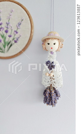 Crocheted doll with dried lavender exudes rustic flair, rustic details elevating handmade charm, rustic aesthetic capturing relaxed ambiance, appealing to mindful decor seekers worldwide 123613887