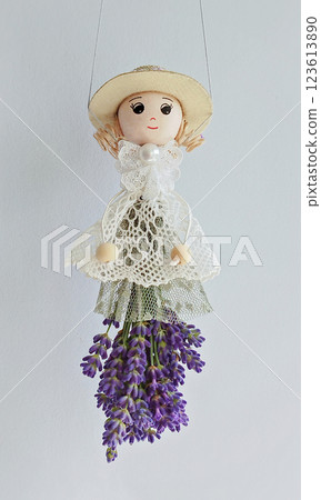Handmade doll with dried blooms captures cozy flair, lavender skirt highlighting delicate style, lavender fragrance promoting relaxing vibe, lavender detail boosting rustic charm 123613890
