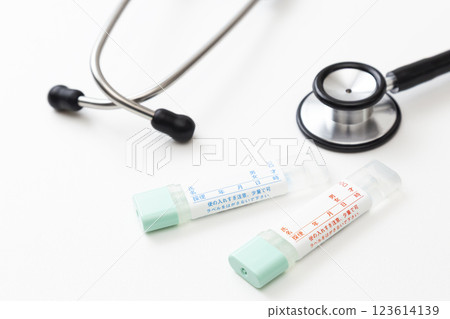 Stool test kit and stethoscope on white background 123614139