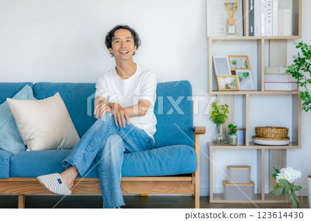 Middle men relaxing in the living room Middle men relaxing in the living room 123614430