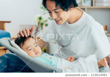 Baby and father lying down Baby and father lying down 123614461