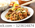 Eating stir-fried horumon on the table with chopsticks 123614874