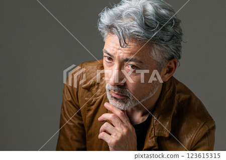 Handsome man sitting on chair 123615315