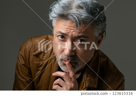 Handsome man sitting on chair 123615316