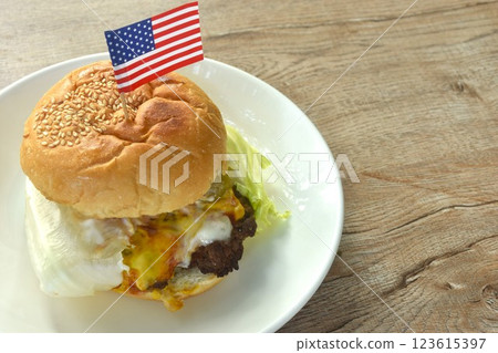 fried mashed beef cheese hamburger and lettuce stuffed mayonnaise sauce with ketchup on plate   123615397