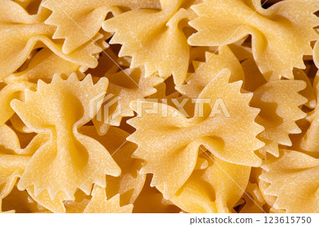 Farfalle pasta, top view. Food background. Farfalle pasta, top view. Food background. 123615750