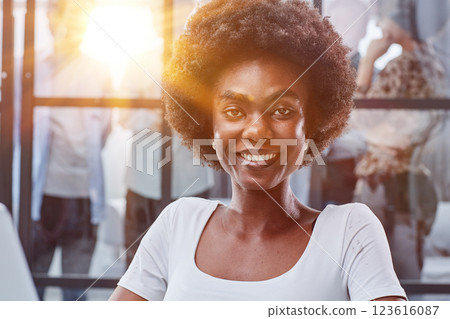 business woman with her staff in background at office 123616087