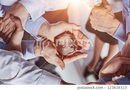 hands of people around the globe, top view 123616323