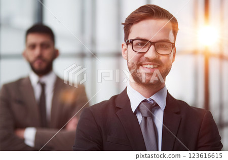 Close up photo portrait of successful and happy businessman working in modern office building, senior investor Close up photo portrait of successful and happy businessman working in modern office building, senior investor 123616615