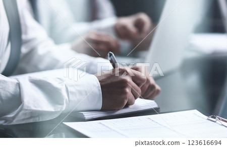 Close-up Of Businessman Filling Customer Survey Form 123616694