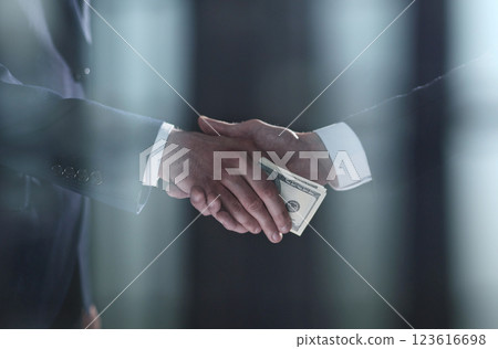 businessman hand giving money on black background businessman hand giving money on black background 123616698