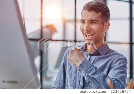 Computer happy professional taking notes, copywriting or research, planning and reading email 123616794