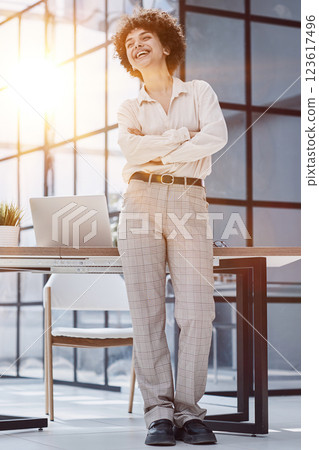 girl in the office smiles expresses success and leadership is thinking about success 123617496