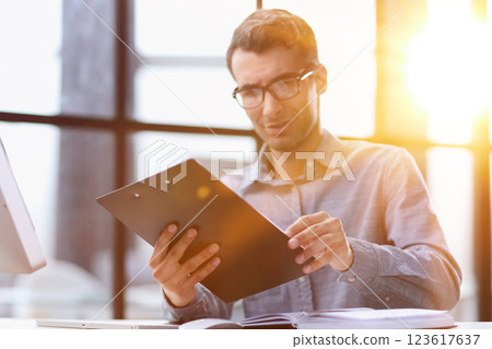 Close Up Of Businessman Taking Folders From Hand 123617637