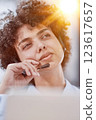 a girl in a modern office working in a call center concentrates on explaining the procedure 123617657