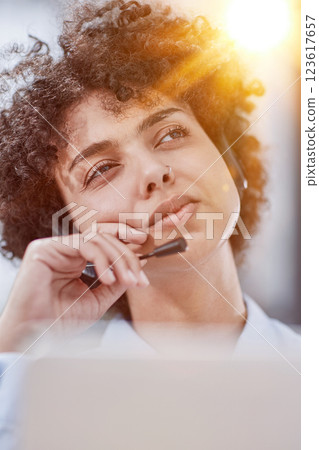 a girl in a modern office working in a call center concentrates on explaining the procedure 123617657
