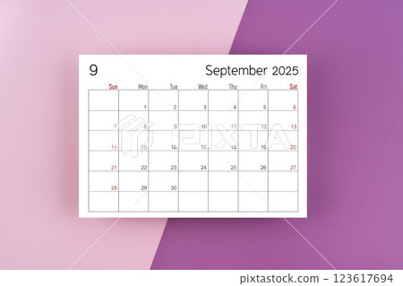 September 2025 calendar page on purple two tone color background. September 2025 calendar page on purple two tone color background. 123617694