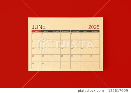 June 2025 desk calendar made from brown paper page on red background. June 2025 desk calendar made from brown paper page on red background. 123617699