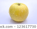 Fresh Golden Delicious Apple with Water Droplets, Close-Up Isolated on White Background 123617730