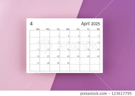 April 2025 calendar page on purple two tone color background. 123617795