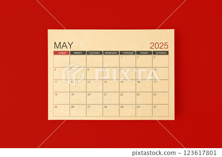 May 2025 desk calendar made from brown paper page on red background. May 2025 desk calendar made from brown paper page on red background. 123617801