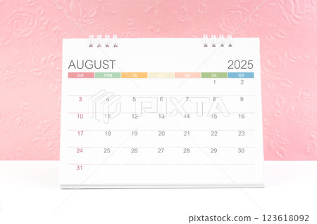 August 2025, Desk calendar with pink flower pattern embossed as background. 123618092