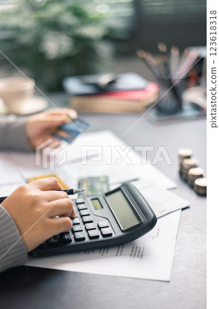 Finance bank tax expense accounting budget money businessman hand use calculator Financial calculate accountant close up calculator with graph chart write office desk Business expense analysis saving Finance bank tax expense accounting budget money businessman hand use calculator Financial calculate accountant close up calculator with graph chart write office desk Business expense analysis saving 123618318