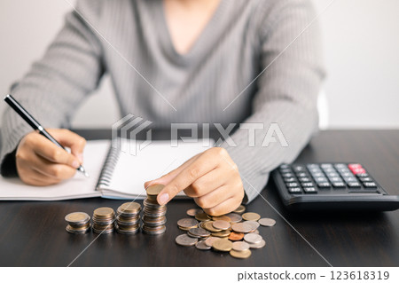 Finance bank tax expense accounting budget money businessman hand use calculator Financial calculate accountant close up calculator with graph chart write office desk Business expense analysis saving Finance bank tax expense accounting budget money businessman hand use calculator Financial calculate accountant close up calculator with graph chart write office desk Business expense analysis saving 123618319
