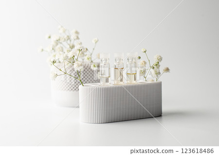 Group of small glass bottles. Perfume testers or chemical samples. Side view. Selective soft focus. Shallow depth of field. Text copy Group of small glass bottles. Perfume testers or chemical samples. Side view. Selective soft focus. Shallow depth of field. Text copy 123618486