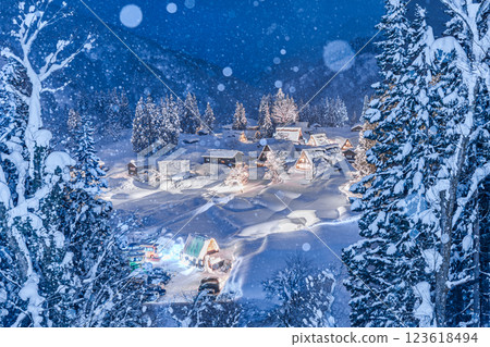 Snowy winter in Gokayama: Ainokura Gassho-style Village, illuminated with spectacular lights Snowy winter in Gokayama: Ainokura Gassho-style Village, illuminated with spectacular lights 123618494