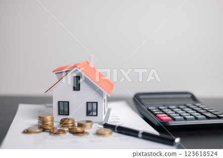 Finance bank tax expense accounting budget money businessman home for Business expense analysis saving use Financial calculate accountant close up calculator with graph chart hand write office desk 123618524