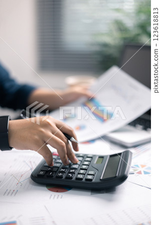 Finance bank tax expense accounting budget money businessman hand use calculator Financial calculate accountant close up calculator with graph chart write office desk Business expense analysis saving Finance bank tax expense accounting budget money businessman hand use calculator Financial calculate accountant close up calculator with graph chart write office desk Business expense analysis saving 123618813