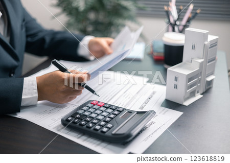 Finance bank tax expense accounting budget money businessman home for Business expense analysis saving use Financial calculate accountant close up calculator with graph chart hand write office desk Finance bank tax expense accounting budget money businessman home for Business expense analysis saving use Financial calculate accountant close up calculator with graph chart hand write office desk 123618819