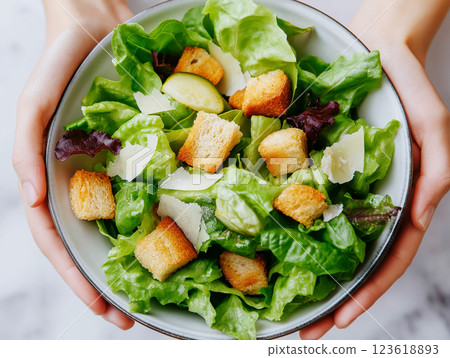 Fresh Caesar salad with crispy croutons, parmesan cheese 123618893