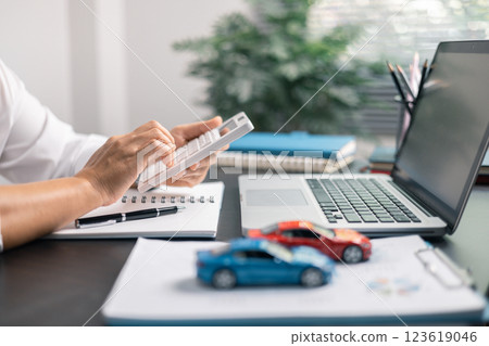 Finance bank tax expense accounting budget money businessman hand for Business expense analysis saving use car Financial calculate accountant close up calculator with graph chart write office desk 123619046