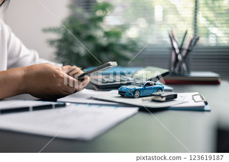 Finance bank tax expense accounting budget money businessman hand for Business expense analysis saving use car Financial calculate accountant close up calculator with graph chart write office desk 123619187