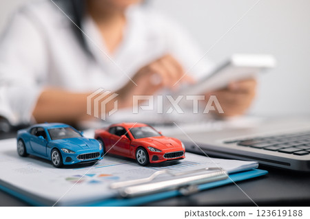 Finance bank tax expense accounting budget money businessman hand for Business expense analysis saving use car Financial calculate accountant close up calculator with graph chart write office desk 123619188
