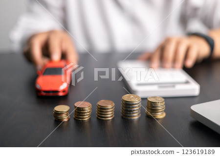 Finance bank tax expense accounting budget money businessman hand for Business expense analysis saving use car Financial calculate accountant close up calculator with graph chart write office desk 123619189