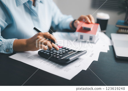 Finance bank tax expense accounting budget money businessman home for Business expense analysis saving use Financial calculate accountant close up calculator with graph chart hand write office desk Finance bank tax expense accounting budget money businessman home for Business expense analysis saving use Financial calculate accountant close up calculator with graph chart hand write office desk 123619248